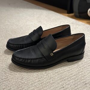 Cole Haan Black Leather Penny Loafers with Gold Accent